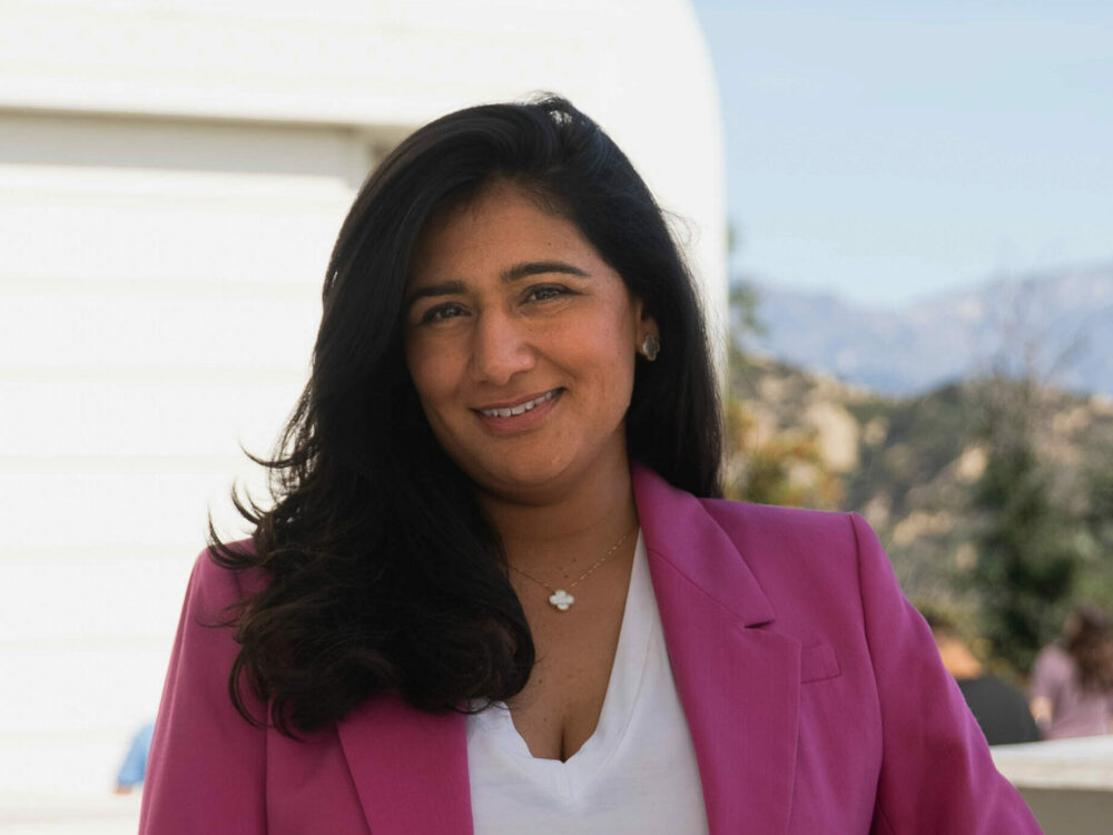 Samira Sohail leaning on the parapet of the South Promenade at Griffith Observatory.